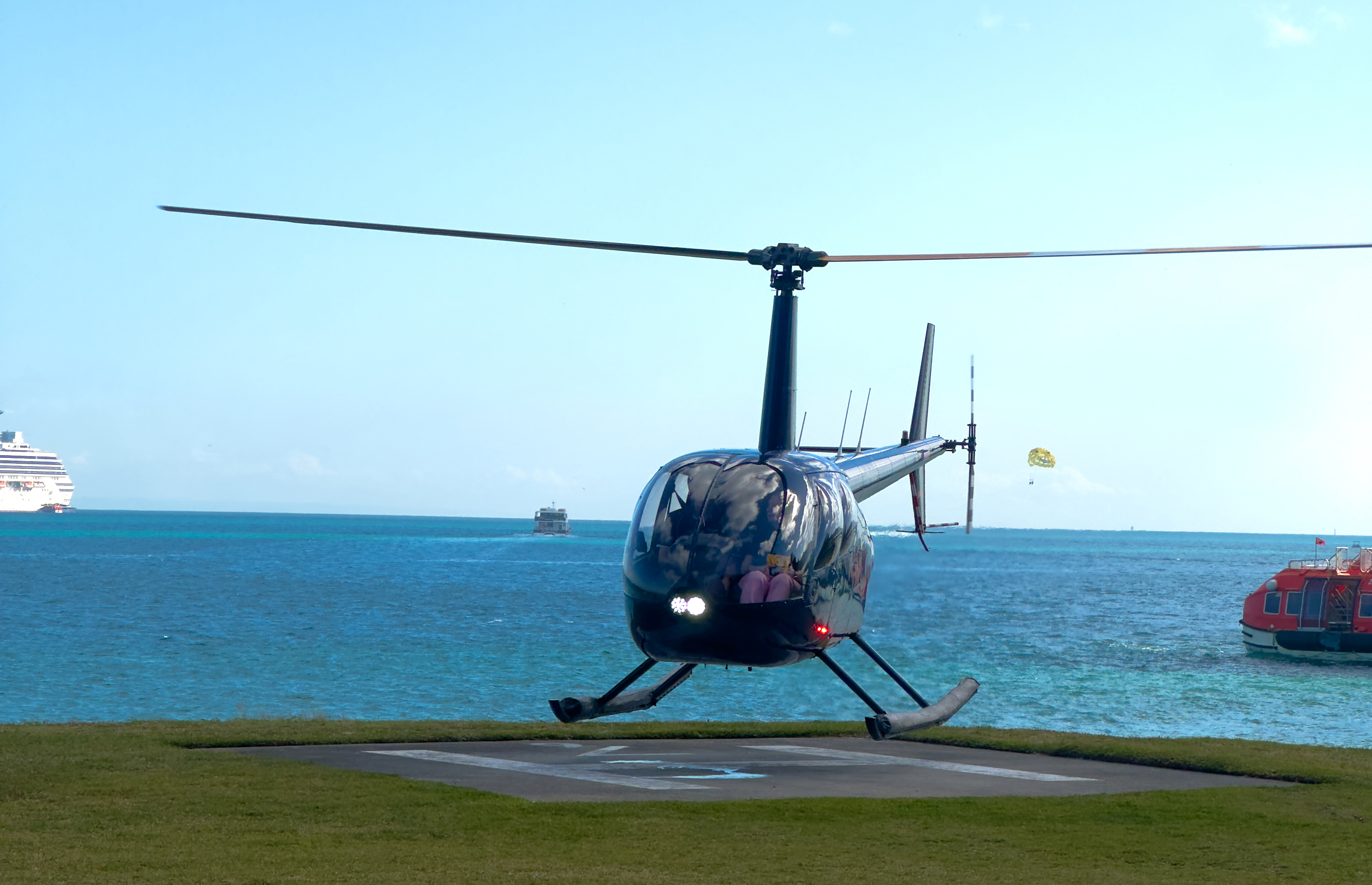 Helicopter flying over Tangalooma Wrecks and Moreton Island
